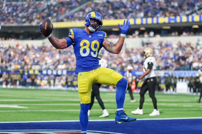 Nov 2, 2025; Inglewood, California, USA; Los Angeles Rams tight end Tyler Higbee (89) reacts after scoring a touchdown against the New Orleans Saints during the first half at SoFi Stadium. Mandatory Credit: Kiyoshi Mio-Imagn Images