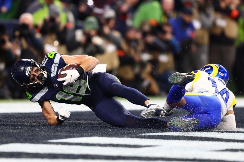 Jan 25, 2026; Seattle, WA, USA; Seattle Seahawks wide receiver Jake Bobo (19) makes a catch for a touchdown against Los Angeles Rams cornerback Cobie Durant (14) during the second half in the 2026 NFC Championship Game at Lumen Field. Mandatory Credit: Kevin Ng-Imagn Images