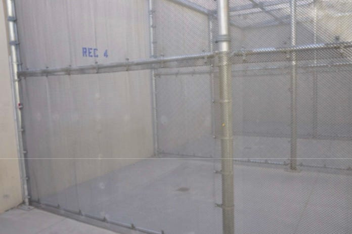 Detainees at the Adelanto ICE Processing Facility say they are treated like dogs in cages. Pictured is the fenced-in recreation area for the disciplinary segregation unit.