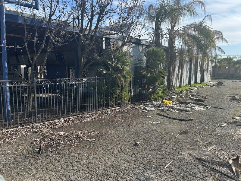 Trash and other debris is scattered around the former Bert & Ernie's bar building on Industrial Street on Thursday, Jan. 29, 2026.
