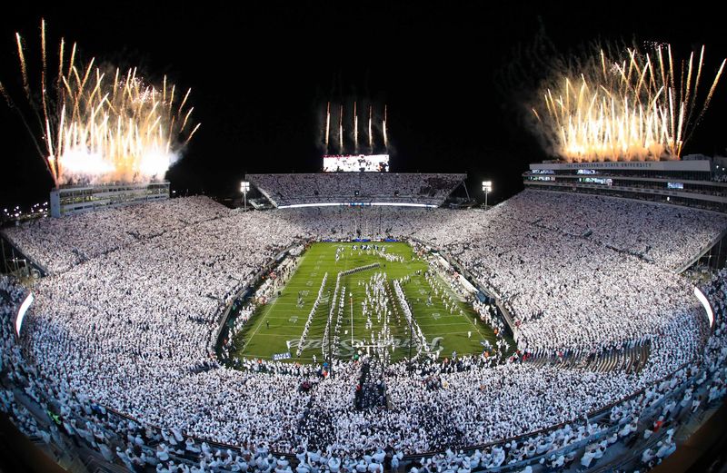 Nov 9, 2024; University Park, Pennsylvania, USA; Fireworks burst overhead as the Penn State Nittany Lions take the field prior to a White Out game against the Washington Huskies at Beaver Stadium. Mandatory Credit: Matthew O'Haren-Imagn Images