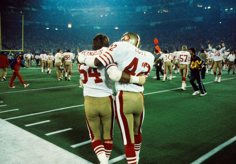 Jan 24, 1982; Pontiac, MI, USA; FILE PHOTO; San Francisco 49ers players Ronnie Lott (42) and Jack Reynolds (64) embrace after defeating the Cincinnati Bengals 26-21 to win Super Bowl XVI at the Pontiac Superdome. Mandatory Credit: Manny Rubio-USA TODAY Sports