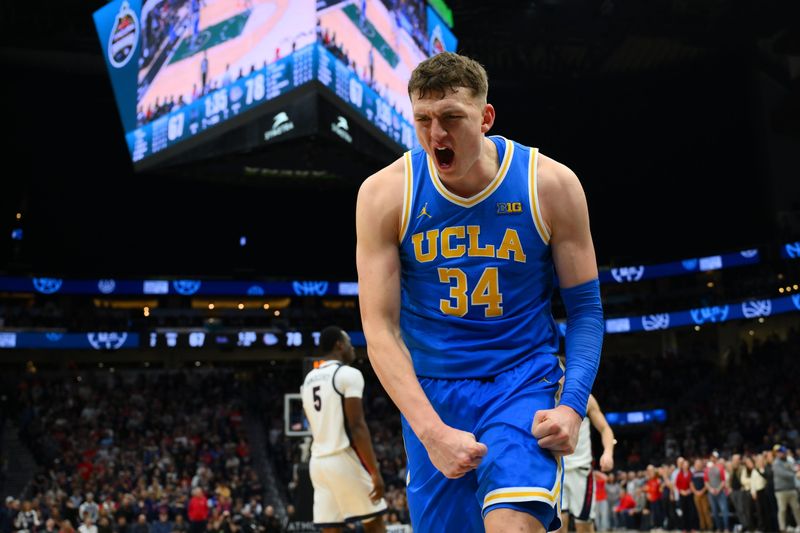 Dec 13, 2025; Seattle, Washington, USA; UCLA Bruins forward Tyler Bilodeau (34) reacts to making a basket against the Gonzaga Bulldogs during the second half at Climate Pledge Arena. Mandatory Credit: Steven Bisig-Imagn Images