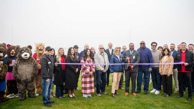 Tulare City School District officials, Tulare City Council members, and school mascots gather for the ribbon-cutting for the new Outdoor Education Complex on Jan. 27, 2026.