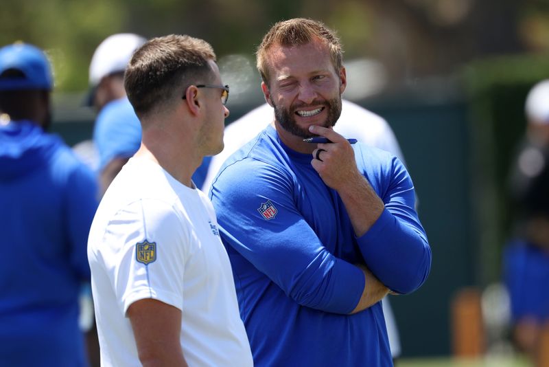 Los Angeles Rams head coach Sean McVay (right) talks with offensive coordinator Mike LaFleur (left) during training camp at Loyola Marymount University in Los Angeles on July 31, 2024.