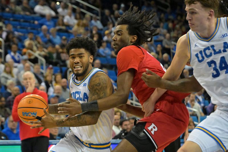 Feb 3, 2026; Los Angeles, California, USA; UCLA Bruins guard Donovan Dent (2) is defended by Rutgers Scarlet Knights forward Bryce Dortch (4) as UCLA Bruins forward Tyler Bilodeau (34) sets a screen in the first half at Pauley Pavilion presented by Wescom Financial. Mandatory Credit: Jayne Kamin-Oncea-Imagn Images
