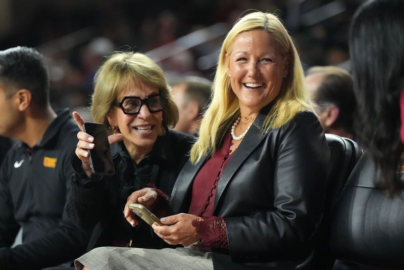 Dec 4, 2024; Los Angeles, California, USA; Southern California Trojans president Carol Folt (left) and athletic director Jennifer Cohen attend a basketball game between the Southern California Trojans and the Oregon Ducks at Galen Center. Mandatory Credit: Kirby Lee-Imagn ImagesDec 4, 2024; Los Angeles, California, USA; at Galen Center. Mandatory Credit: Kirby Lee-Imagn Images