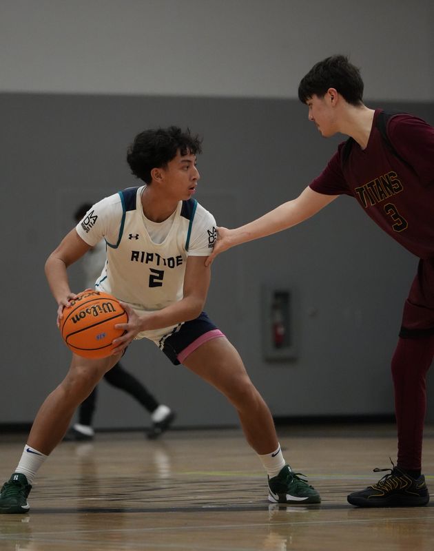 River Islands guard Charles Mapanao, left, squares up his defender while looking to make a move during a game against ALHA on Jan. 15. River Islands won 58–53.