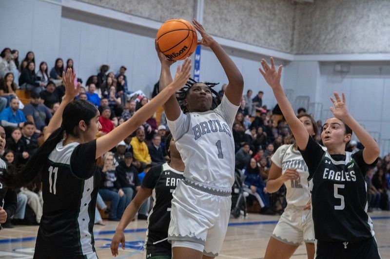 McNair’s Touraya Blakey, center, drives to the hoop on Bear Creek’s Navleen Kaur, left, and Manal Wisal during a girls varsity basketball game at Bear Creek High School in Stockton on Feb. 5, 2026.