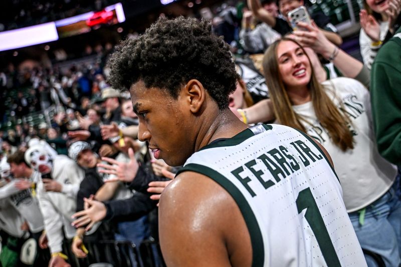 Michigan State's Jeremy Fears Jr. slaps hands with fans after the Spartans win over Illinois on Saturday, Feb. 7, 2026, at the Breslin Center in East Lansing.