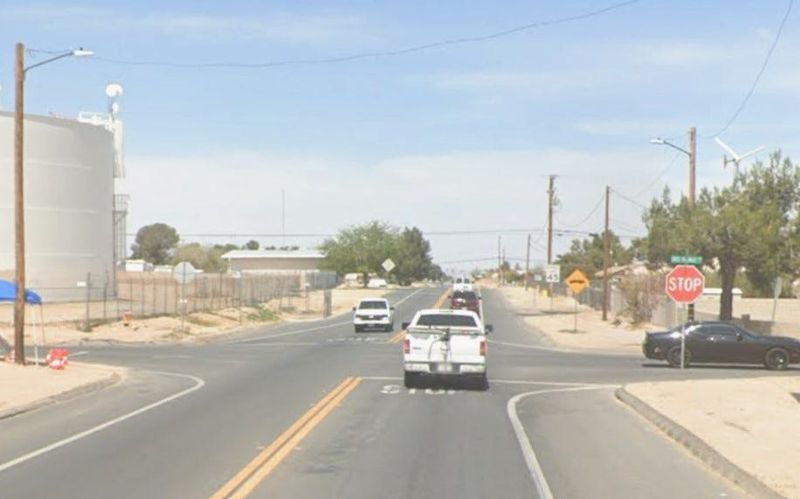 The intersection of El Evado Road and Dos Palmas Road in an unincorporated county area just outside of Victorville.