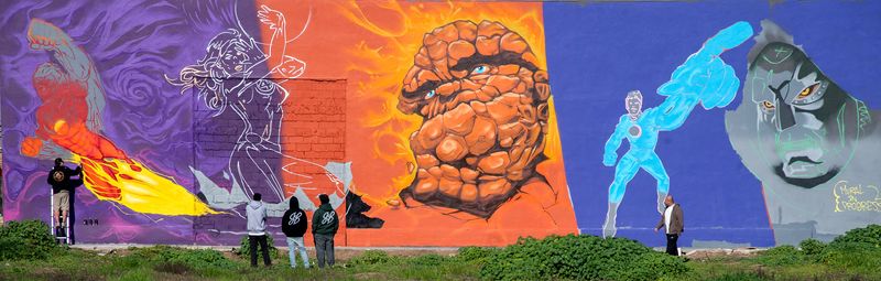 A mural is being painted on the south wall of Al’s Comics in the 1800 block of Pacific Avenue along the Miracle Mile in Stockton on Jan. 24, 2025. The mural, approximately 80-feet long by 20-feet tall, features vignettes of the Fantastic Four with Mr. Fantastic, the Invisible Woman, the Human Torch and the ever-lovin’, blue-eyed Thing, as well as their nemesis Dr. Doom. Four muralists as well as several assistants to complete the mural which takes up the entire side of the building. In 1986, Stockton was declared as the hometown of the Fantastic Four. CLIFFORD OTO/THE STOCKTON RECORD