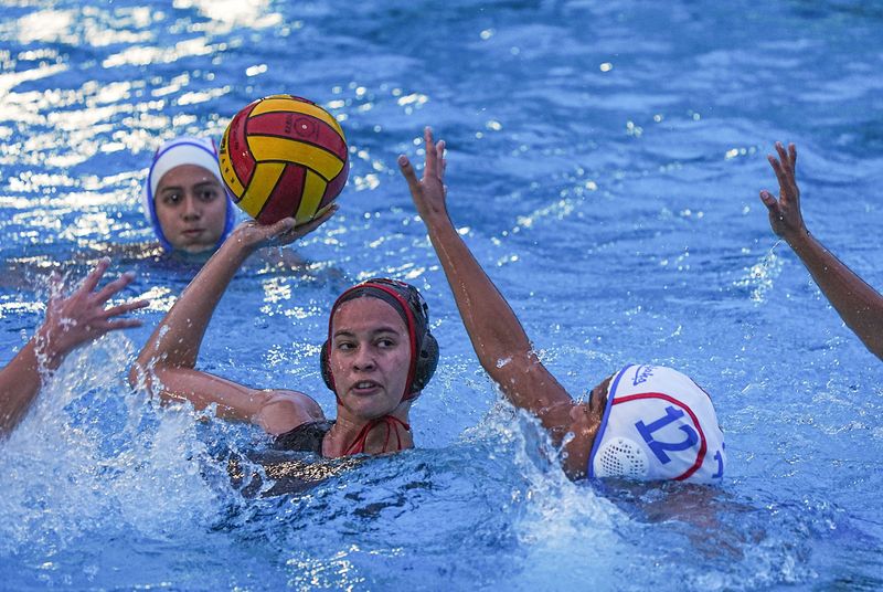 Alaina Vega, 17, of Palm Springs scores against the Indio defense in the CIF-SS water polo playoff game in Palm Springs, Calif., Feb. 11, 2026.