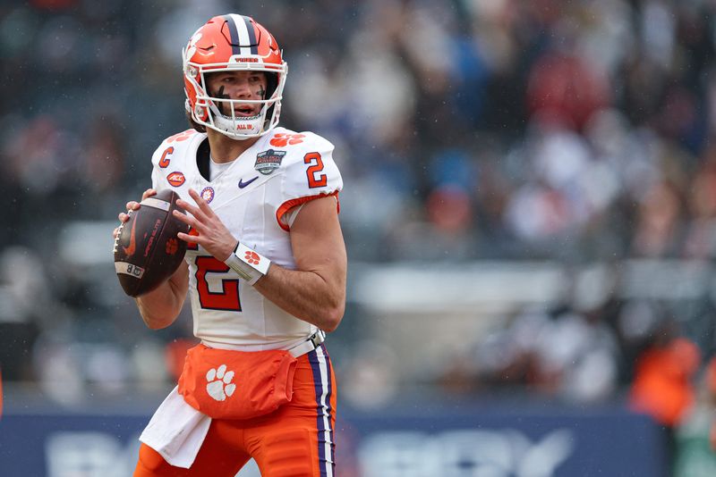 Dec 27, 2025; Bronx, NY, USA; Clemson Tigers quarterback Cade Klubnik (2) looks to pass during the first half of the 2025 Pinstripe Bowl against the Penn State Nittany Lions at Yankee Stadium. Mandatory Credit: Vincent Carchietta-Imagn Images
