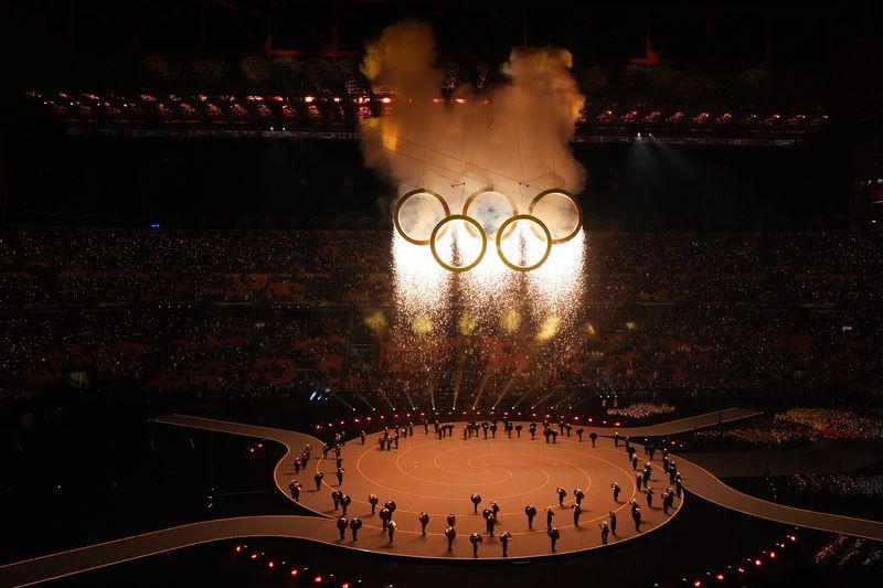 Feb 6, 2026; Milan, ITALY; The Olympic rings during the cauldron lighting during the Opening Ceremony for the Milano Cortina 2026 Olympic Winter Games at Milano San Siro Olympic Stadium. Mandatory Credit: Amber Searls-Imagn Images