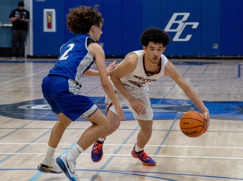 Weston Ranch’s Romello Bruhn, right, drives on Bear Creek’s Xavier Terry during a boys varsity basketball game in the SJAA season tournament at Bear Creek High School in Stockton on Feb. 12, 2026. Weston Ranch won 85-58.