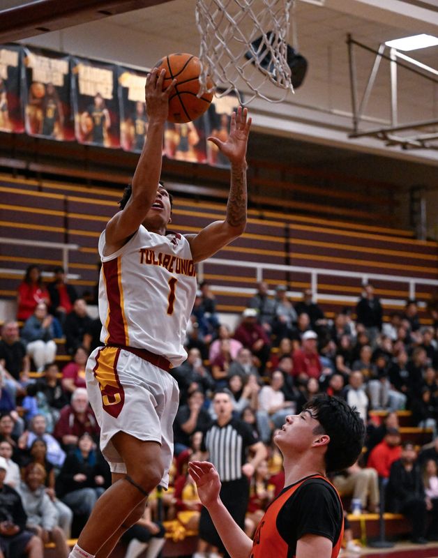 Tulare Union's Demaje Riley goes up for two against Selma in a Central Section Division III high school boys basketball playoff Friday, February 13, 2026.