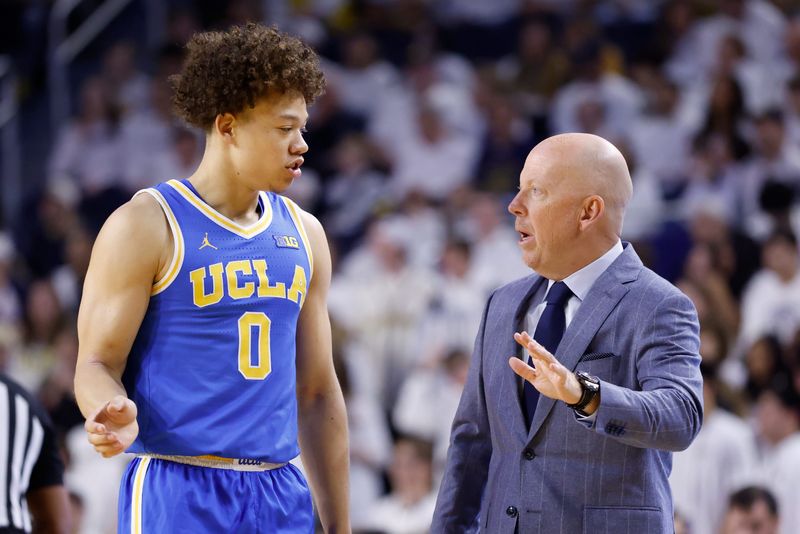 Feb 14, 2026; Ann Arbor, Michigan, USA; UCLA Bruins head coach Mick Cronin talks to guard Trent Perry (0) in the first half against the Michigan Wolverines at Crisler Center. Mandatory Credit: Rick Osentoski-Imagn Images