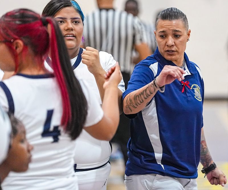 Desert Hot Springs head coach Vanessa Alvarado talks with her players just before the start of the third quarter in their Division 9 CIF-SS game in Desert Hot Springs, Calif., Saturday, Feb. 14, 2026.