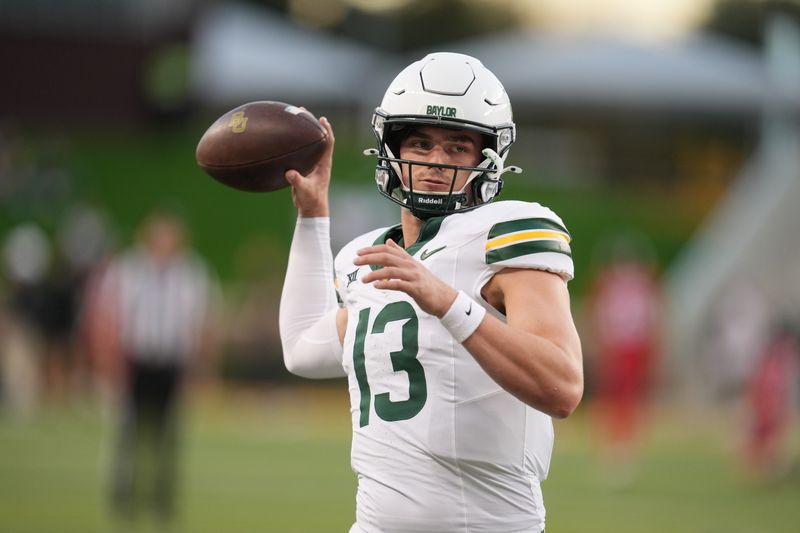 Nov 15, 2025; Waco, Texas, USA; Baylor Bears quarterback Sawyer Robertson (13) during warmups before the game against the Utah Utes at McLane Stadium. Mandatory Credit: Chris Jones-Imagn Images