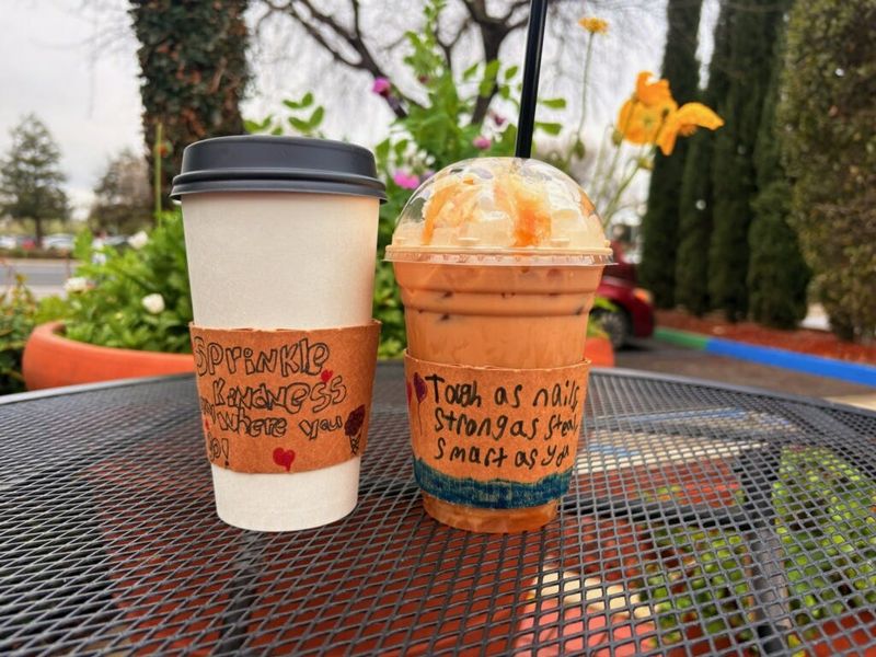 Kindness drink sleeves designed by Valley Life students.