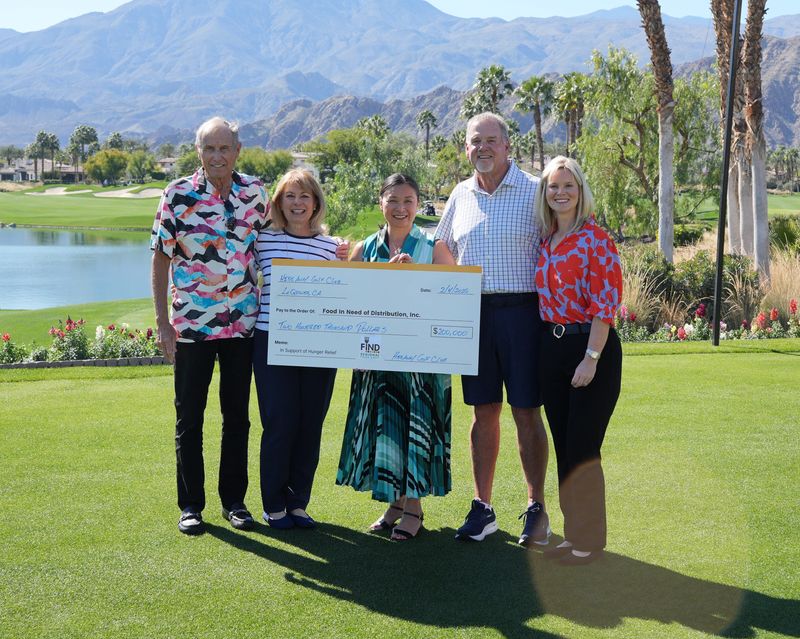 Hideaway members present a $200,000 check to FIND Regional Food Bank on Feb. 4, 2026.