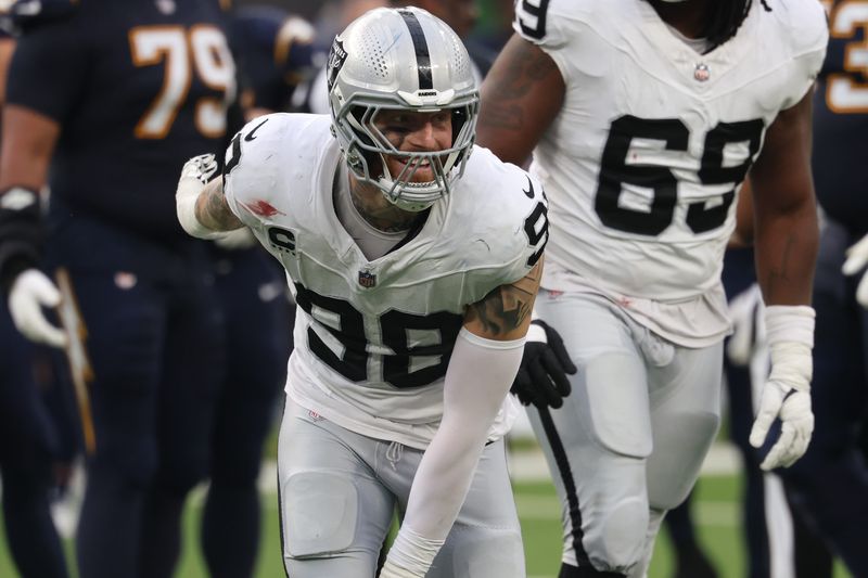 Nov 30, 2025; Inglewood, California, USA; Las Vegas Raiders defensive end Maxx Crosby (98) reacts against the Los Angeles Chargers during the first half at SoFi Stadium. Mandatory Credit: Kiyoshi Mio-Imagn Images