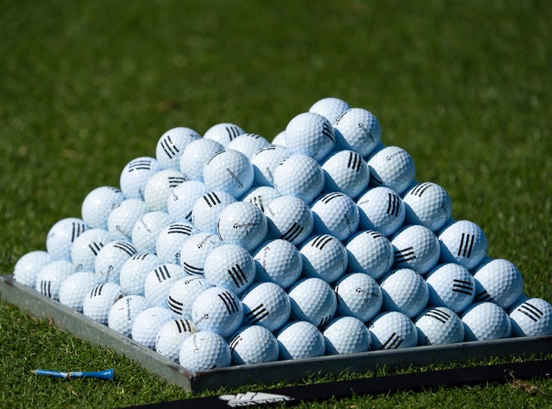A partial pyramid of golf balls are set ready on the driving range for players after the end of The Prestige collegiate golf tournament at PGA West in La Quinta, Calif., Wednesday, Feb. 18, 2026.