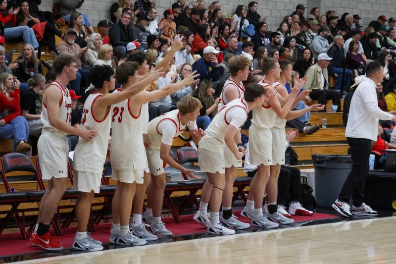 The Foothill Cougar boys basketball bench gets on their feet to cheer on their teammates. Feb. 20, 2026.