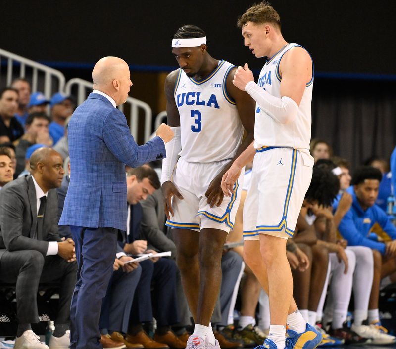 Feb 21, 2026; Los Angeles, California, USA; UCLA Bruins head coach Mick Cronin with guard Eric Dailey Jr. (3) and UCLA forward Tyler Bilodeau (34) during the second half at Pauley Pavilion presented by Wescom Financial. Mandatory Credit: Robert Hanashiro-Imagn Images