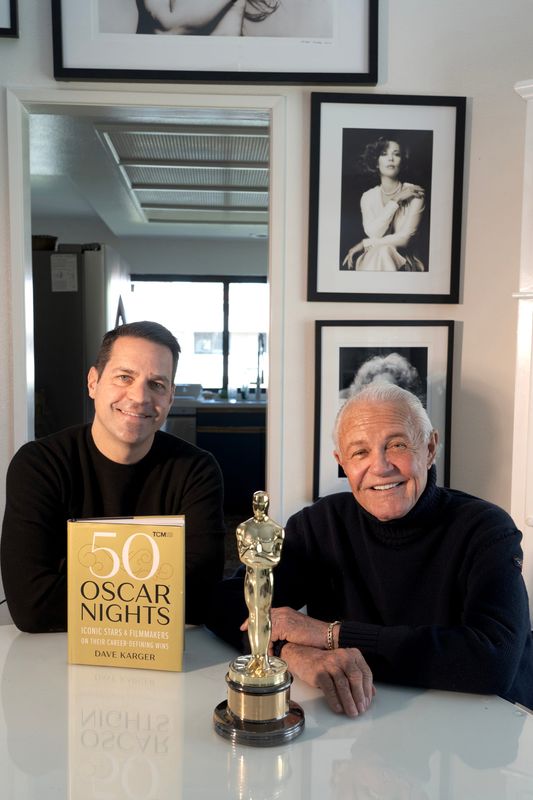 Dave Karger, left, and Michael Childers are photographed in Palm Springs, Calif., on Feb. 18, 2026. They will host One Night in Hollywood, a show at the Plaza Theatre featuring selections from Academy Award winning films on March 10.