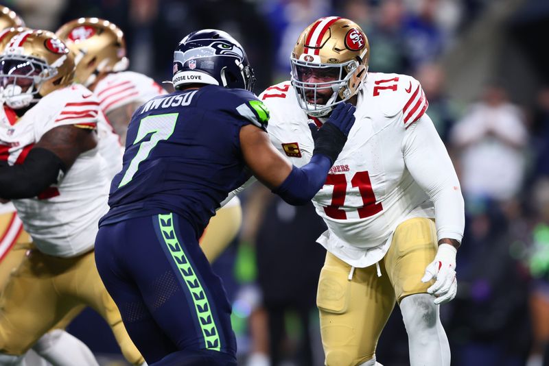 Jan 17, 2026; Seattle, WA, USA; San Francisco 49ers offensive tackle Trent Williams (71) blocks Seattle Seahawks linebacker Uchenna Nwosu (7) during the first half in an NFC Divisional Round game at Lumen Field. Mandatory Credit: Kevin Ng-Imagn Images