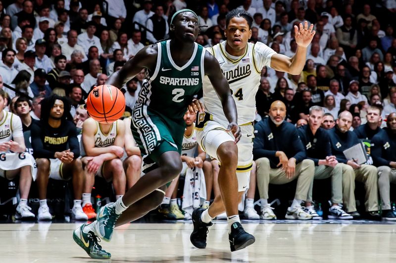 Gicarri Harris chases down Michigan State's Kur Teng (2) during the first half of Purdue's game against Michigan State on Feb. 26, 2026, at Mackey Arena in West Lafayette, IN.