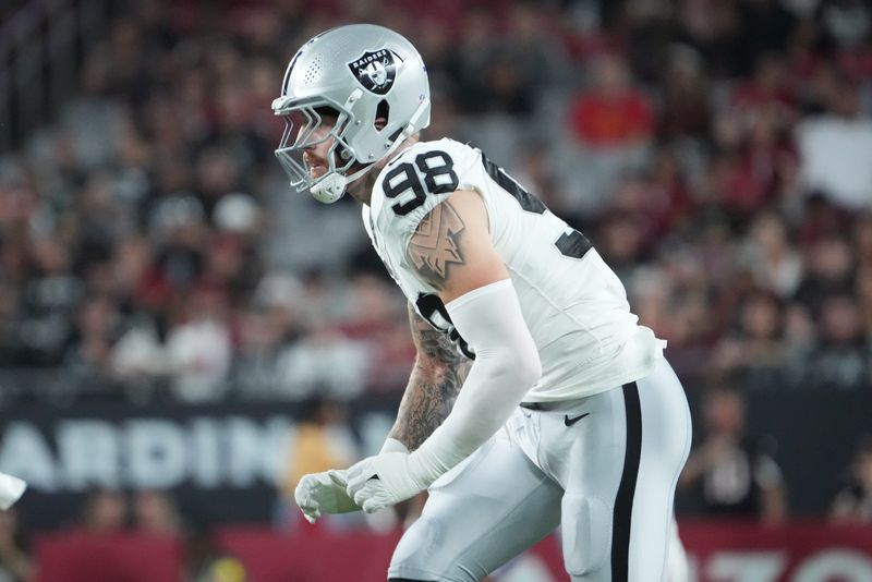 Aug 23, 2025; Glendale, Arizona, USA; Las Vegas Raiders defensive end Maxx Crosby (98) pursues the play against the Arizona Cardinals during the first half at State Farm Stadium. Mandatory Credit: Joe Camporeale-Imagn Images
