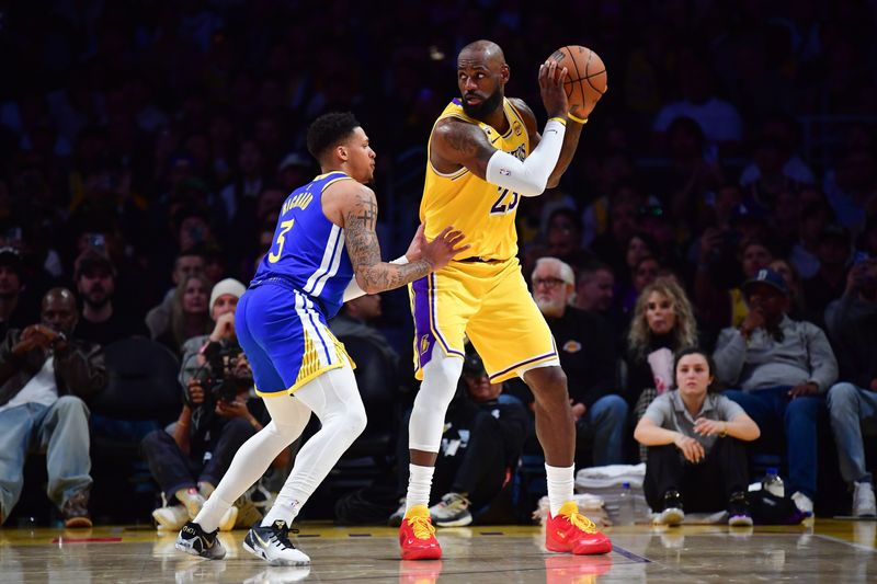 Feb 7, 2026; Los Angeles, California, USA; Los Angeles Lakers forward LeBron James (23) controls the ball against Golden State Warriors guard Will Richard (3) during the second half at Crypto.com Arena. Mandatory Credit: Gary A. Vasquez-Imagn Images