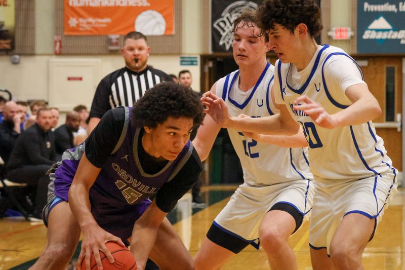 U-Prep's Ethan Nelsen (front) and Aiden Hall (back) double team an Oroville player in the NSCIF Division IV championship game. Feb. 28, 2026.