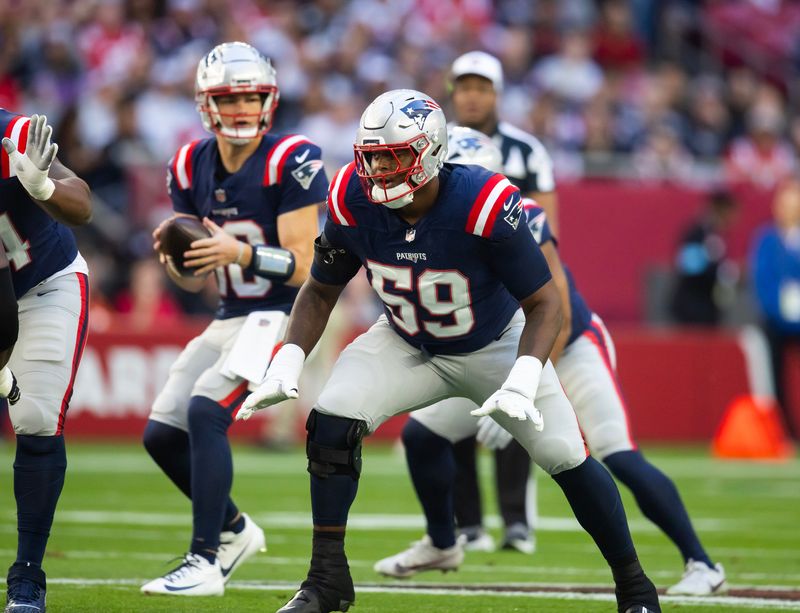 Dec 15, 2024; Glendale, Arizona, USA; New England Patriots offensive tackle Vederian Lowe (59) against the Arizona Cardinals at State Farm Stadium. Mandatory Credit: Mark J. Rebilas-Imagn Images