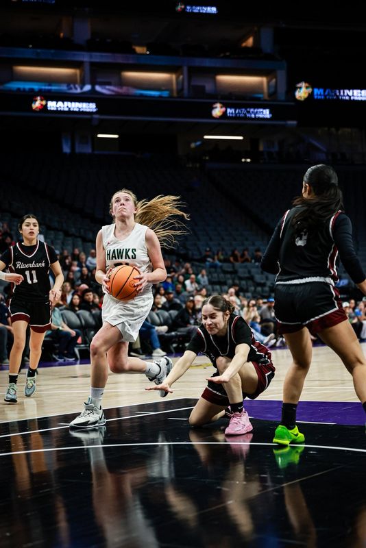 Liberty Ranch guard Haley Smith picks up her dribble as a Riverbank defender falls during the CIF Sac-Joaquin Section Division IV championship game at Golden 1 Center on Feb. 27, 2025. Liberty Ranch won 55–50.