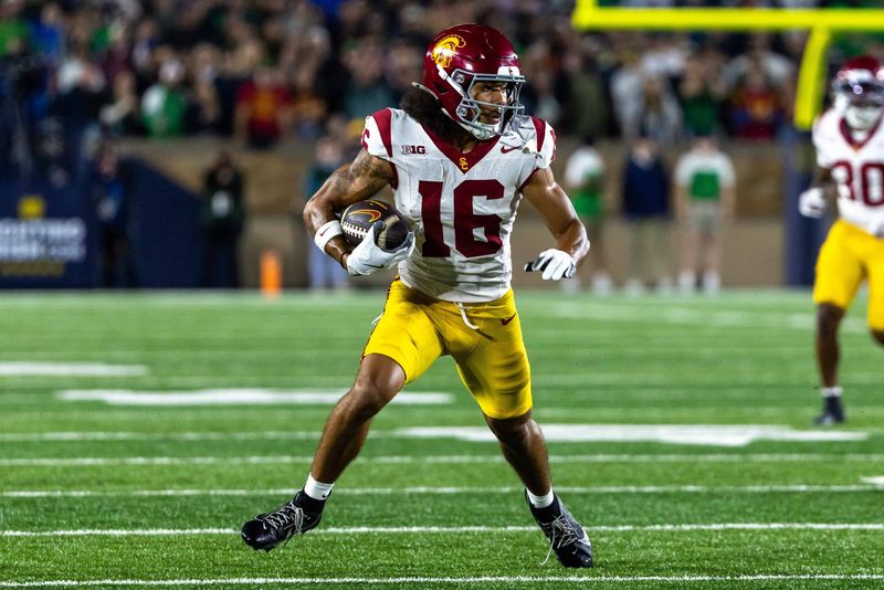 Oct 18, 2025; South Bend, Indiana, USA; Southern California Trojans wide receiver Tanook Hines (16) runs the ball against the Notre Dame Fighting Irish during the first half at Notre Dame Stadium. Mandatory Credit: Michael Caterina-Imagn Images