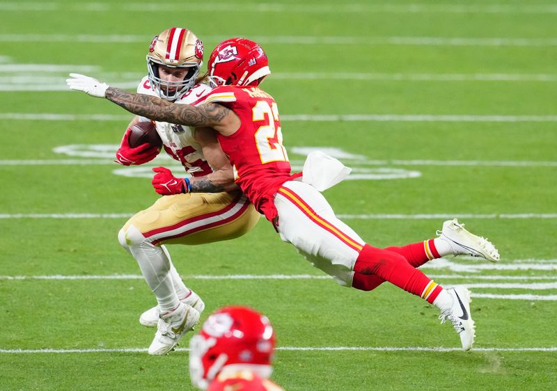 Feb 11, 2024; Paradise, Nevada, USA; San Francisco 49ers tight end George Kittle (85) catches a pass against Kansas City Chiefs cornerback Trent McDuffie (22) in the fourth quarter in Super Bowl LVIII at Allegiant Stadium. Mandatory Credit: Stephen R. Sylvanie-USA TODAY Sports