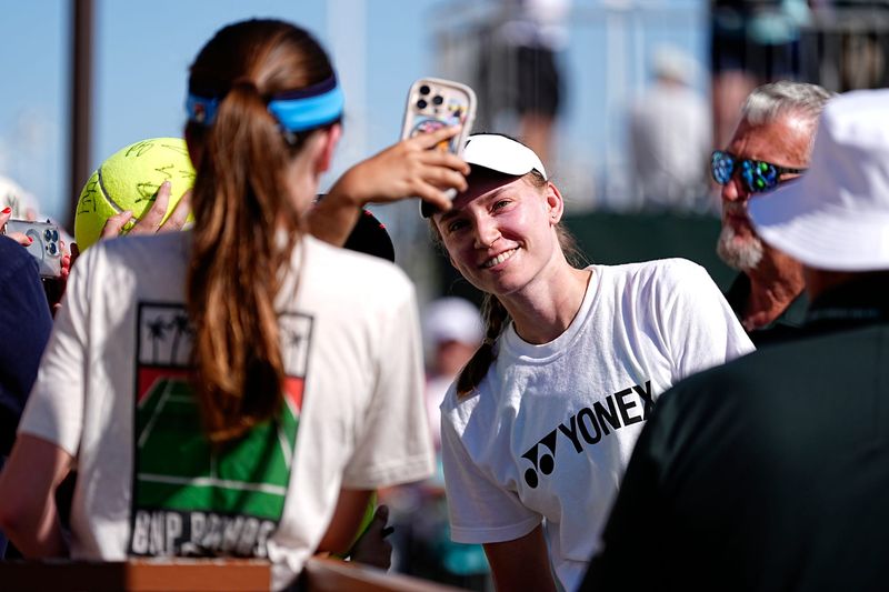 Elena Rybakina takes a photograph with a fan during the BNP Paribas Open in Indian Wells, Calif., on Wednesday, March 4, 2026.