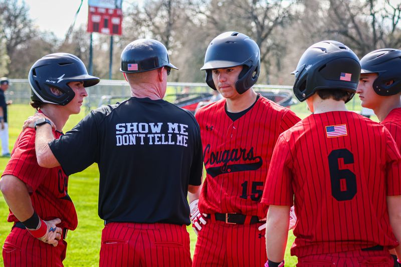 Foothill head coach Todd Buck speaks to his players during a West Valley pitching change. March 5, 2026.