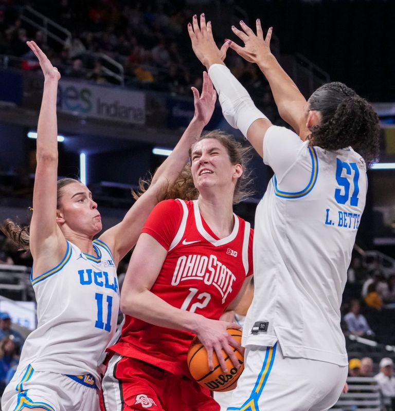 UCLA Bruins forward Gabriela Jaquez (11) and UCLA Bruins center Lauren Betts (51) stop Ohio State Buckeyes center Elsa LemmilÃ¤ (12) on Saturday, March 7, 2026, during a Big Ten women's basketball tournament semifinals game at Gainbridge Fieldhouse in Indianapolis.