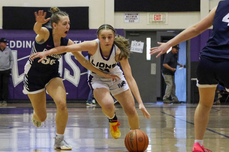 Redding Christian freshman guard Weslynn Skinner drives down the court with a Falcon defender on her hip. Skinner scored 14 points in the semifinal game to help the Lions defeat the Falcons 52-26. March 7, 2026.