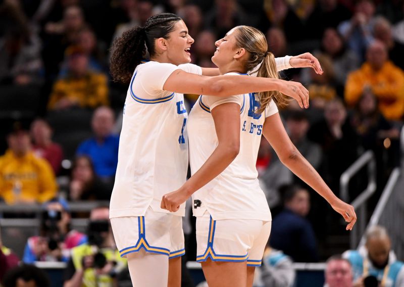 Mar 8, 2026; Indianapolis, IN, USA; UCLA Bruins center Lauren Betts (51) and UCLA Bruins forward Sienna Betts (16) celebrate after a play against the Iowa Hawkeyes during the first half at Gainbridge Fieldhouse. Mandatory Credit: Robert Goddin-Imagn Images