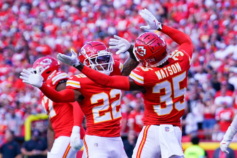 Sep 15, 2024; Kansas City, Missouri, USA; Kansas City Chiefs cornerback Trent McDuffie (22) celebrates with cornerback Jaylen Watson (35) after a play against the Cincinnati Bengals during the first half at GEHA Field at Arrowhead Stadium. Mandatory Credit: Denny Medley-Imagn Images