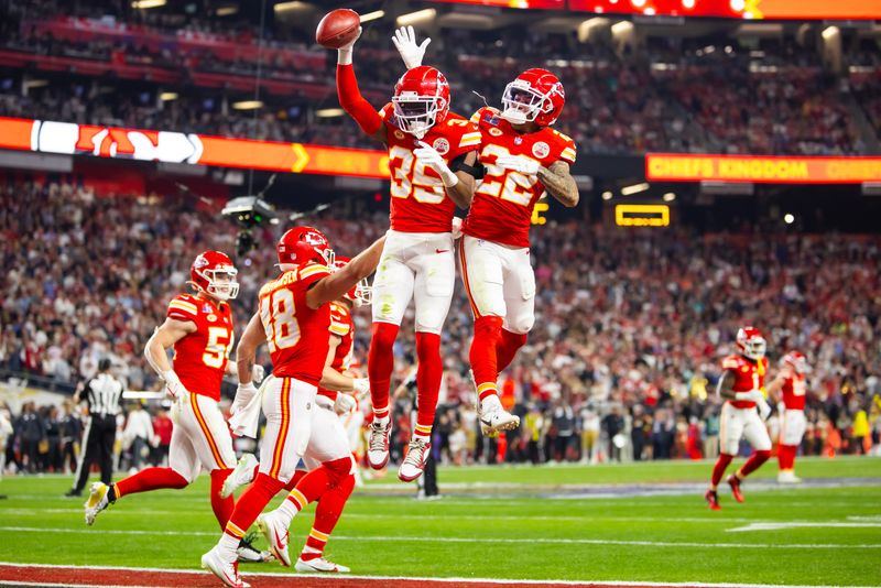 Feb 11, 2024; Paradise, Nevada, USA; Kansas City Chiefs cornerback Jaylen Watson (35) celebrates with Trent McDuffie (22) after recovering a muffed punt against the San Francisco 49ers in the second half in Super Bowl LVIII at Allegiant Stadium. Mandatory Credit: Mark J. Rebilas-USA TODAY Sports
