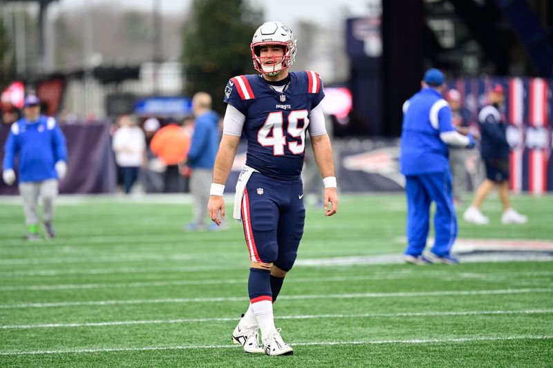 Dec 17, 2023; Foxborough, Massachusetts, USA; New England Patriots long snapper Joe Cardona (49) warms up before a game against the Kansas City Chiefs at Gillette Stadium. Mandatory Credit: Eric Canha-USA TODAY Sports