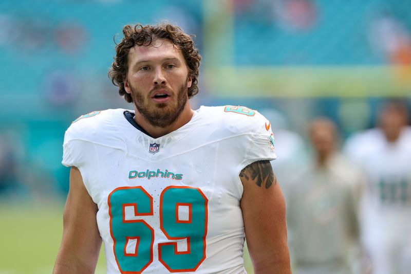 Sep 14, 2025; Miami Gardens, Florida, USA; Miami Dolphins guard Cole Strange (69) looks on before a game against the New England Patriots at Hard Rock Stadium. Mandatory Credit: Nathan Ray Seebeck-Imagn Images