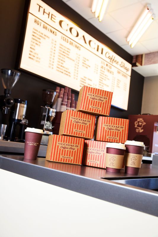 Drinks and pastry boxes sit on the counter at The Coach Coffee Shop.